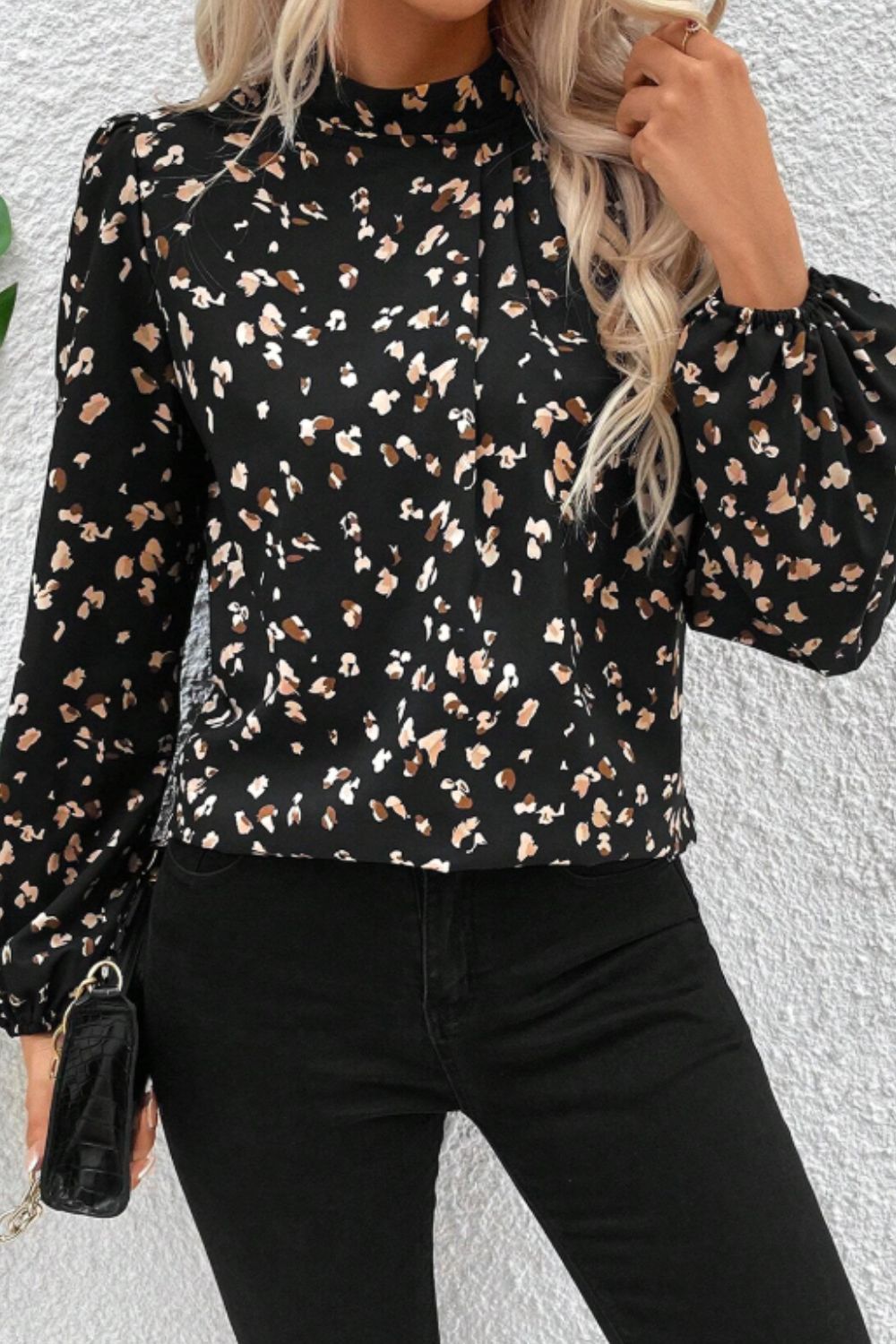 Black high-neck blouse with abstract print and puff sleeves