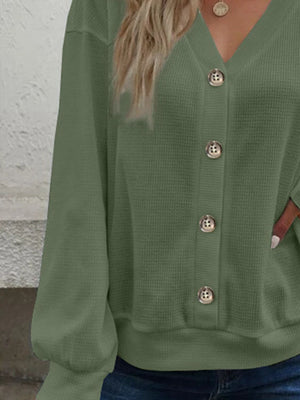 Matcha green waffle knit button-down cardigan with balloon sleeves and gold buttons.