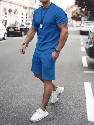 Men's blue crew neck t-shirt and drawstring shorts co-ord set.