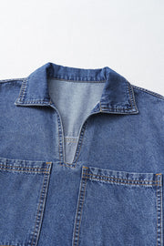 Light blue denim mini dress with collar, V-neck, and two chest pockets.