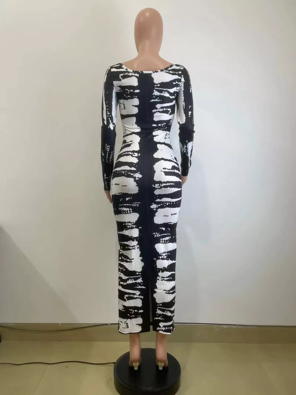 Black and white tie-dye maxi dress with long sleeves and a scoop neck.