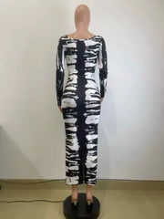 Black and white tie-dye maxi dress with long sleeves and a scoop neck.