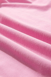 Pink cotton co-ord set with ruffled neckline detail