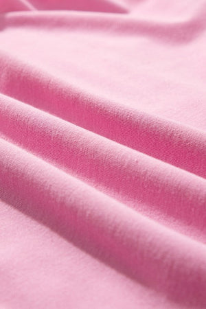 Pink cotton co-ord set with ruffled neckline detail