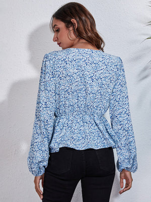 Misty blue floral print cinched waist blouse with balloon sleeves.