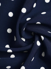 Navy polka dot A-line maxi dress fabric detail