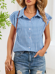 Blue gingham cotton shirt with cap sleeves and button-down front.