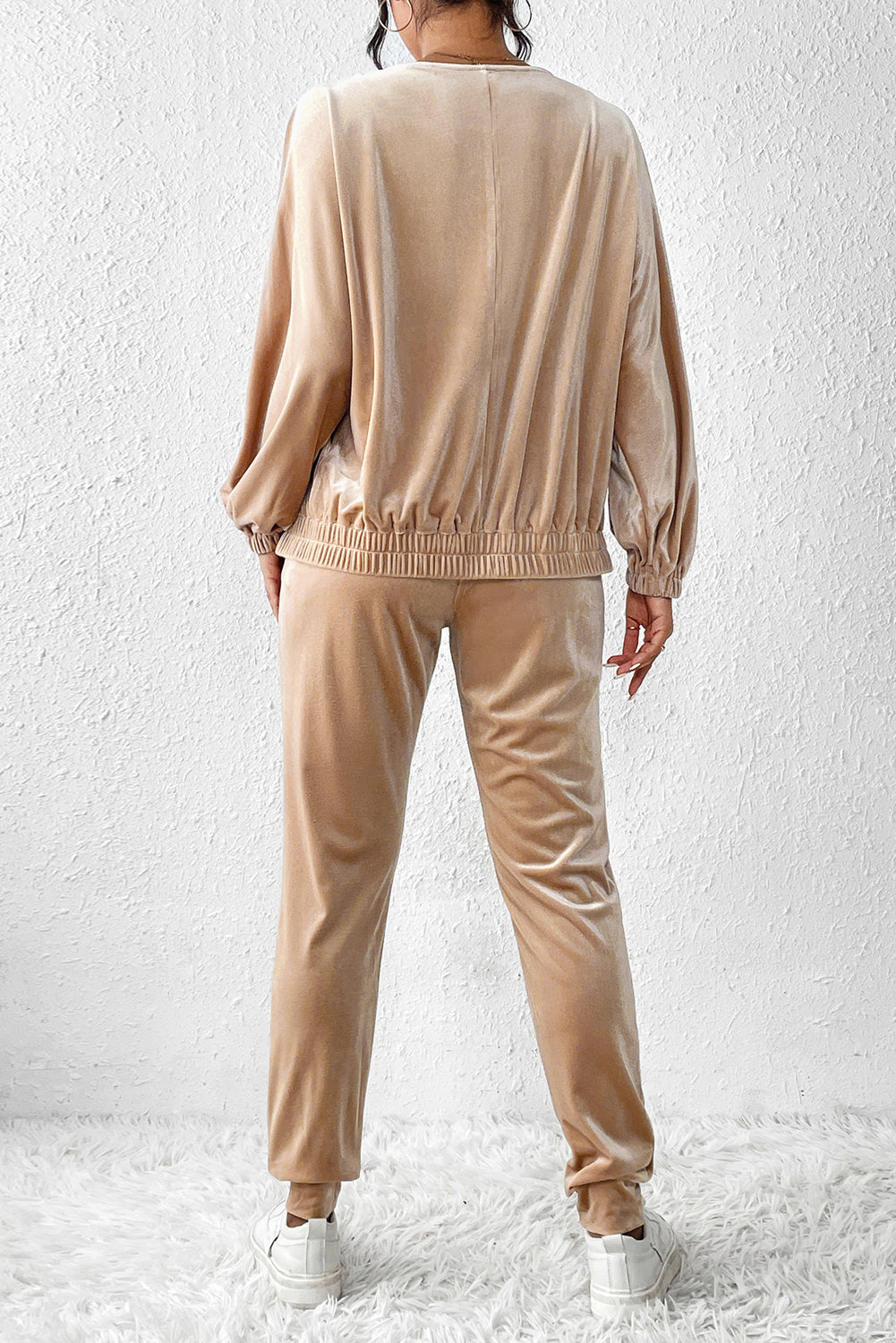 Tan velvet tracksuit joggers with elasticated waistband and cuffs, and a relaxed fit top.