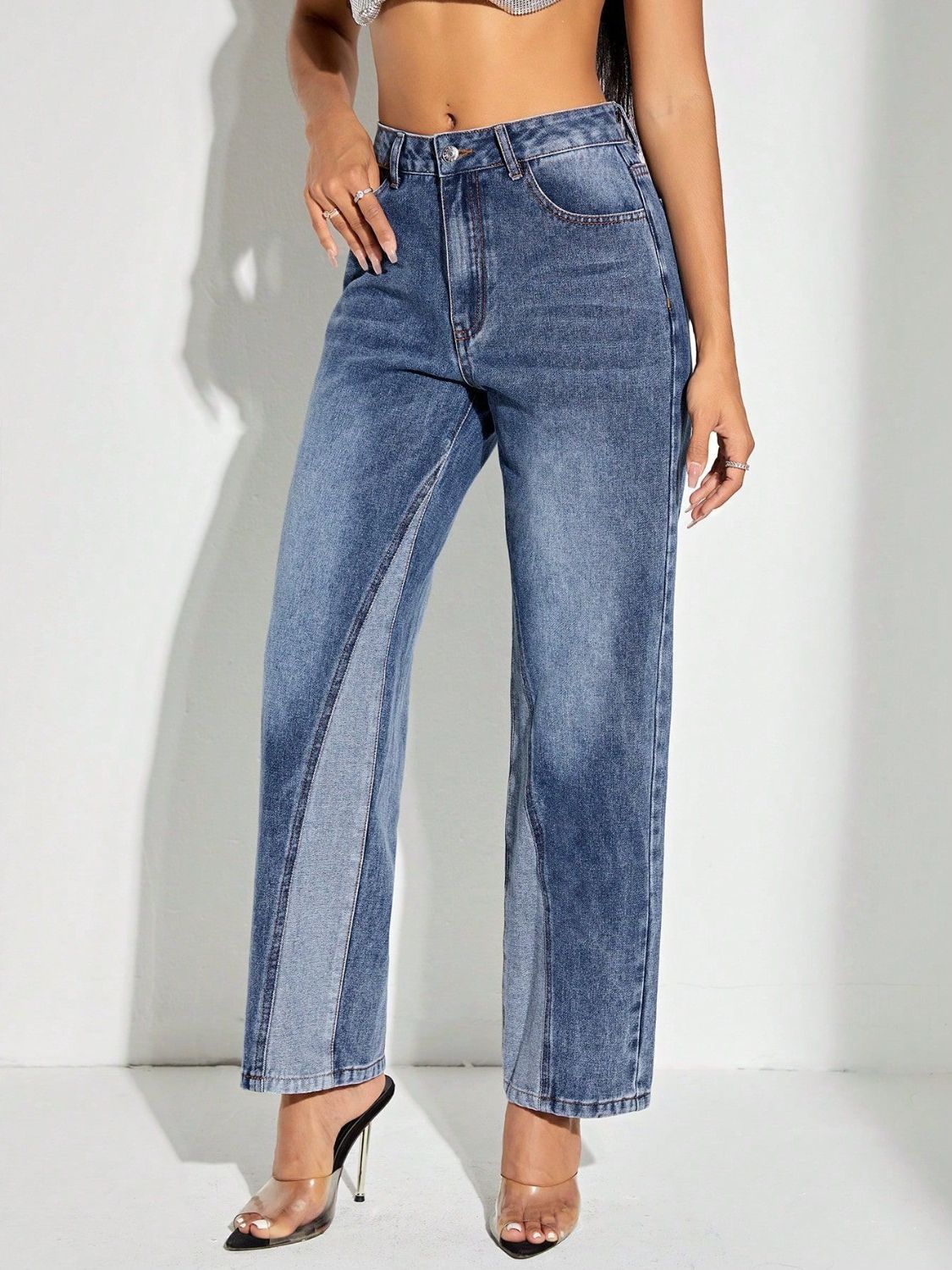 Panelled denim straight leg jeans in medium wash with contrasting light blue panels.