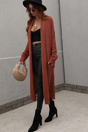 Textured knit maxi cardigan in brown with open front and pockets.