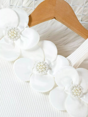 White ribbed tank top with floral applique and pearl details