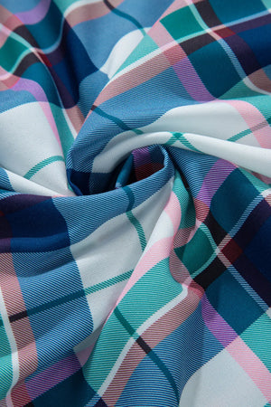 Plaid pajama fabric with ruffled hem detail in blue, pink, green, and white.