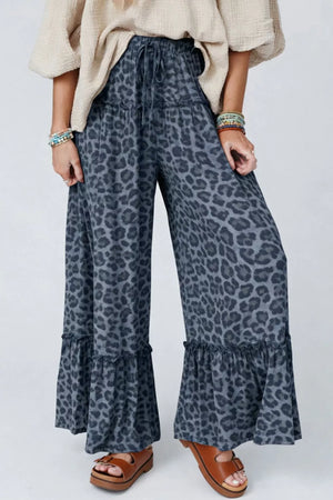 Leopard print maternity pants in dark navy with ruffled wide legs and drawstring waist.