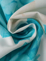 Teal floral print maxi dress fabric detail with V-neck and ruffle sleeve style