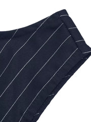 Navy striped tie-waist A-line dress detail showing fabric texture and white pinstripes.