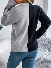 Split-face knit sweater in gray and black, crew neck, long sleeves, ribbed hem and cuffs.