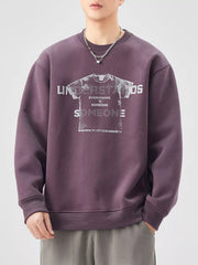 Men's oversized purple graphic sweatshirt with crew neck and long sleeves.