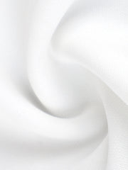 Elegant white mini dress fabric detail with soft ruffles.