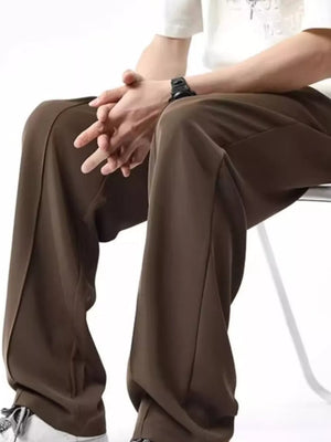 Men's coffee brown wide leg sweatpants with drawstring waist and stitched seams.