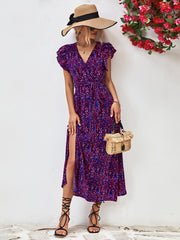 Blue purple floral wrap midi dress with flutter sleeves and a belted waist.