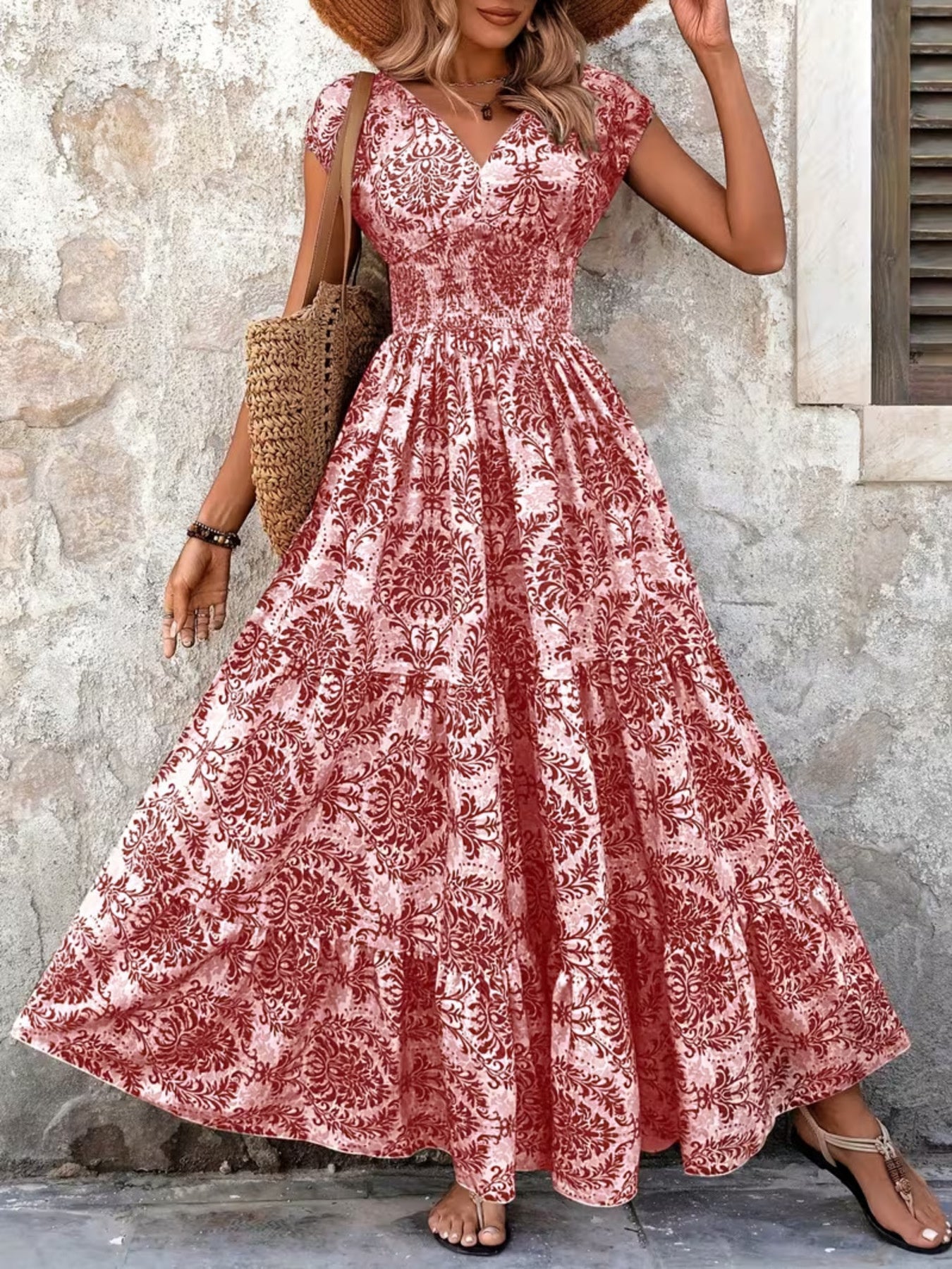 Red damask print maxi dress with cap sleeves and smocked bodice.