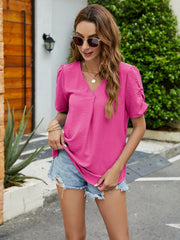 Hot Pink textured blouse with V-neck, pleats, and ruched sleeves.