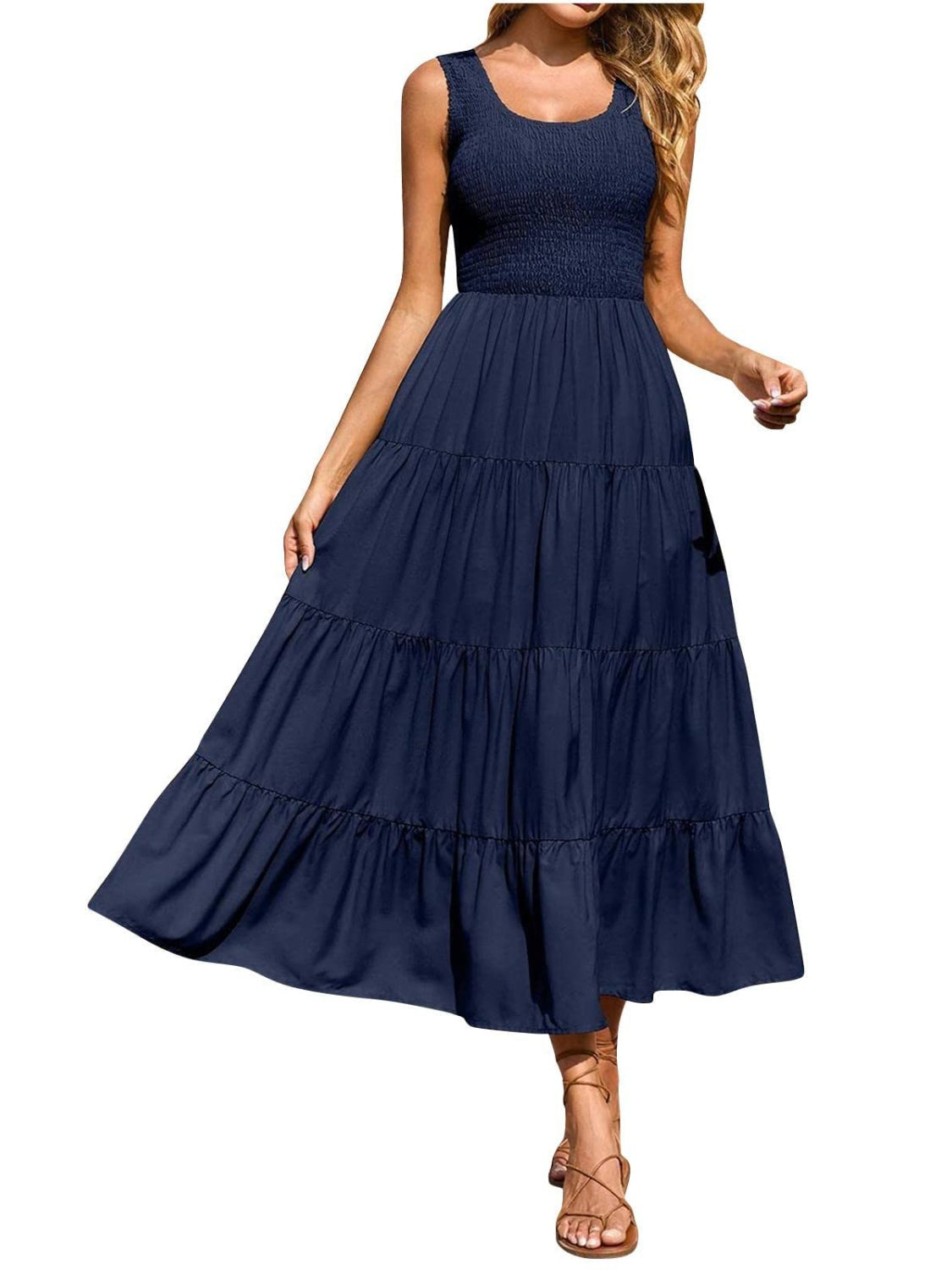 Dark blue smocked bodice ruffled maxi dress with tiered skirt and square neckline.