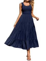 Dark blue smocked bodice ruffled maxi dress with tiered skirt and square neckline.