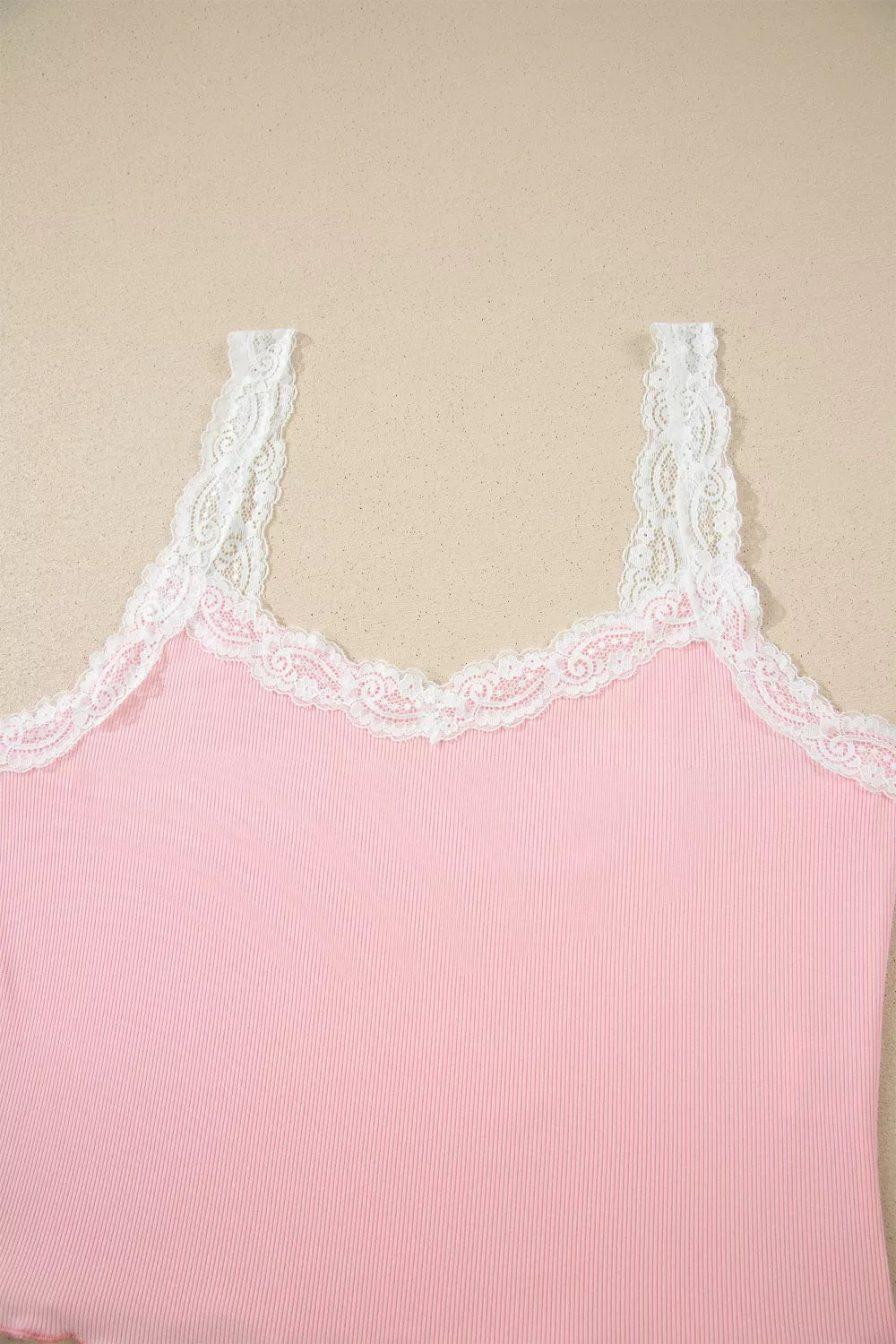 Pink ribbed cami with white lace trim and adjustable straps