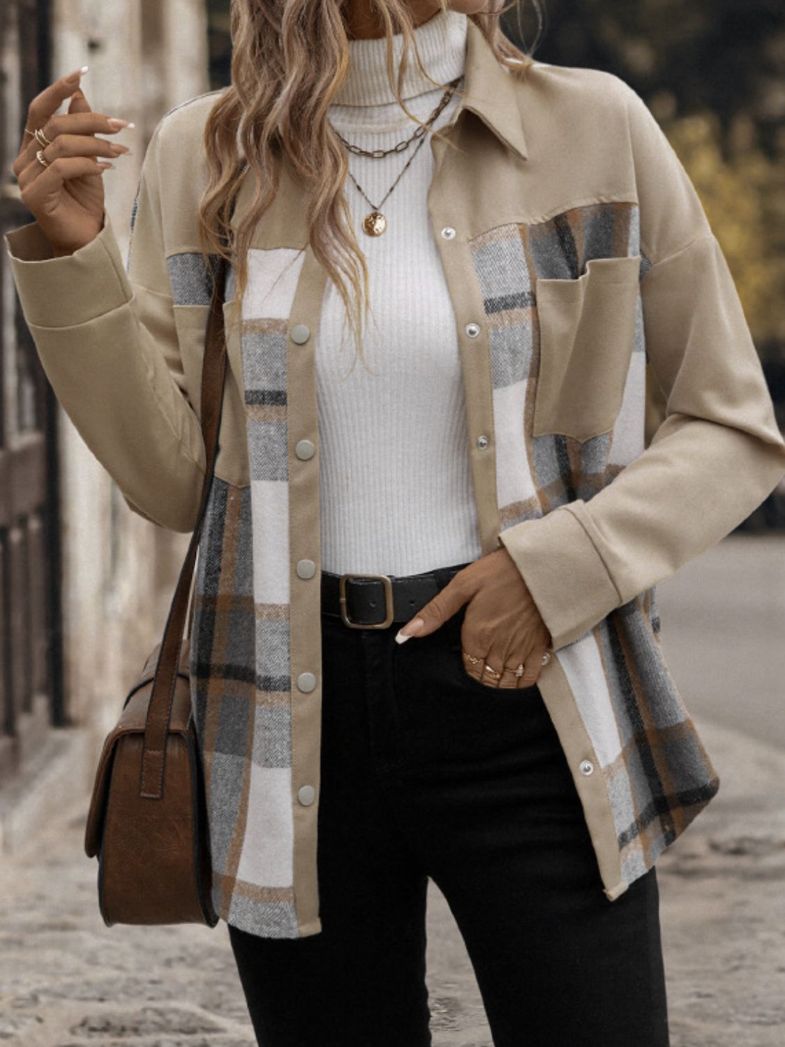 Tan plaid shacket with patch pockets and button front, made of cotton.