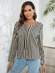 Vertical stripe blouse with keyhole neckline and long sleeves.