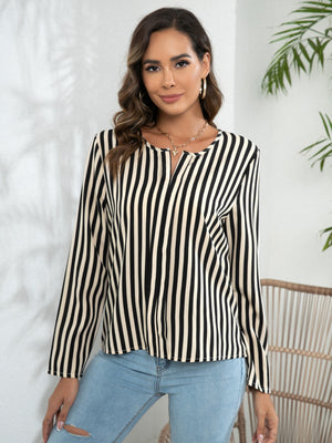 Vertical stripe blouse with keyhole neckline and long sleeves.
