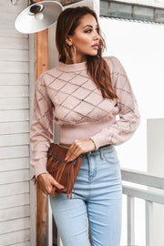 Blush pink diamond knit cropped sweater with mock neck and long sleeves.