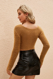 Plush wrap crop sweater in camel with long sleeves and a ribbed texture.