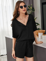 Black waffle knit henley short set with drawstring shorts and short sleeves.