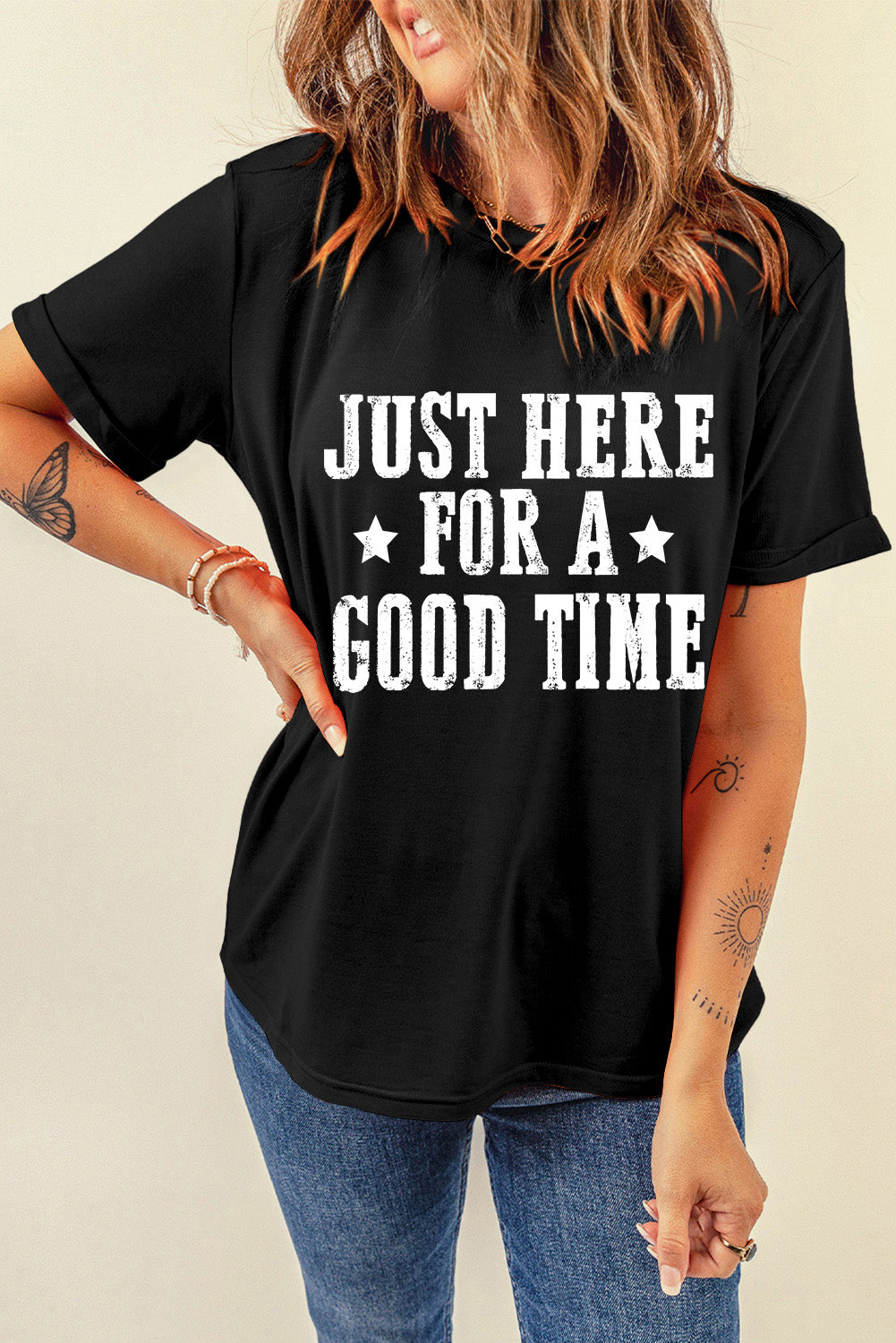 Black graphic tee with white text that reads Just Here For A Good Time, short sleeves, cotton blend.