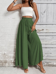 Ruffled waistline palazzo trousers in dark green with drawstring waist.