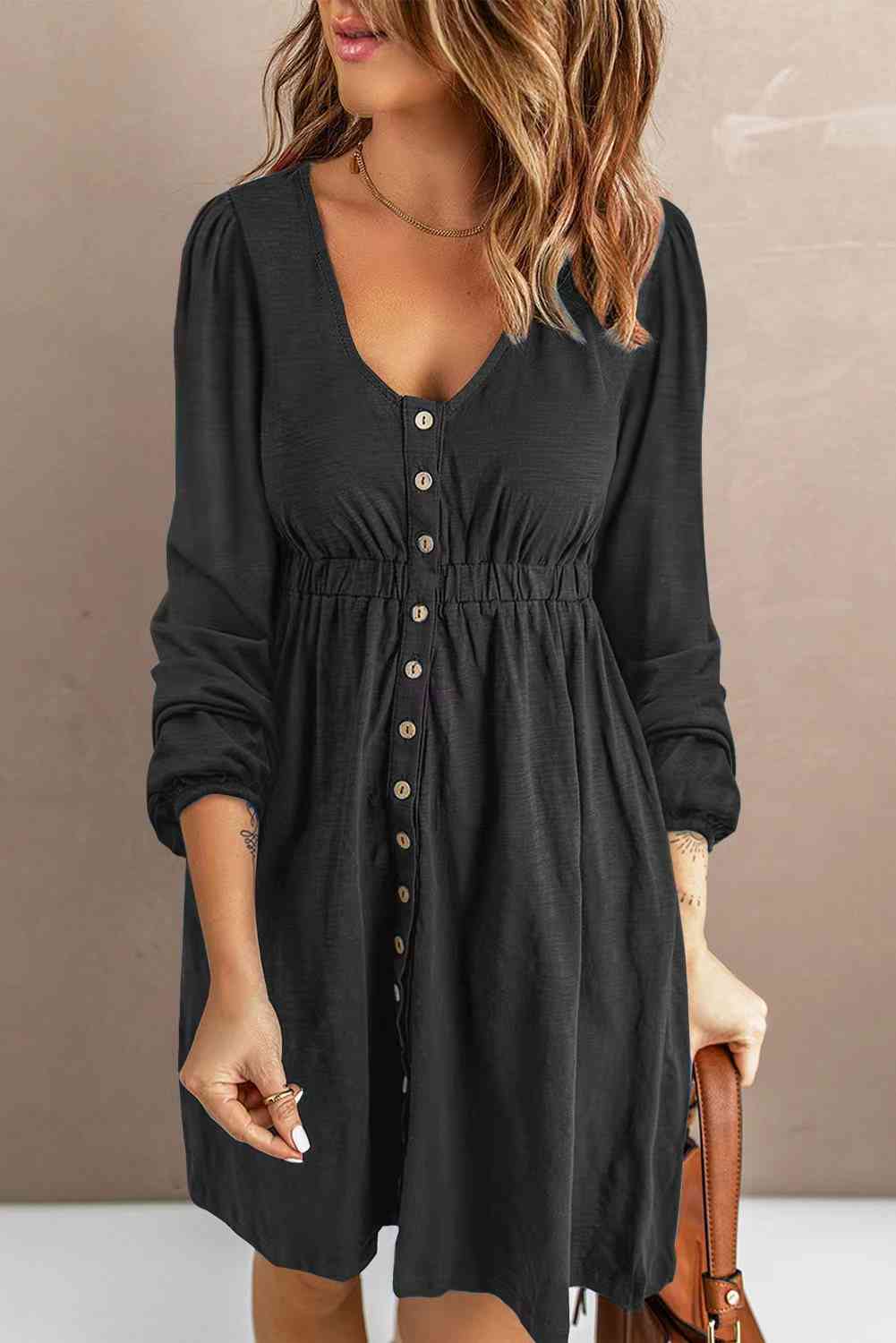 Button-down empire waist mini dress in black with V-neck and long sleeves
