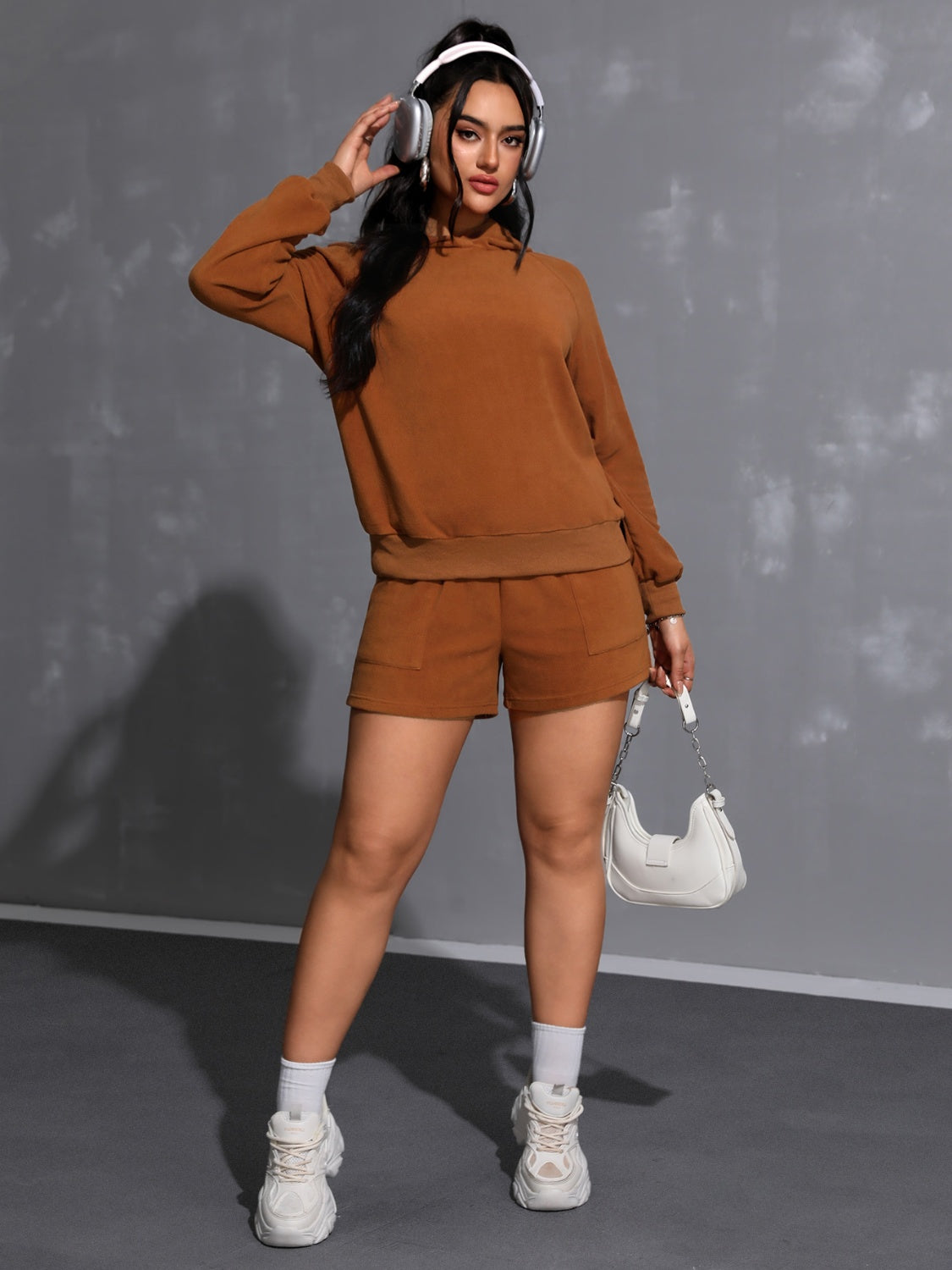 Caramel fleece loungewear set with raglan sleeve hoodie and pocket shorts.