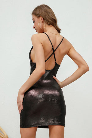 Black metallic slip dress with cowl back and crisscross straps.