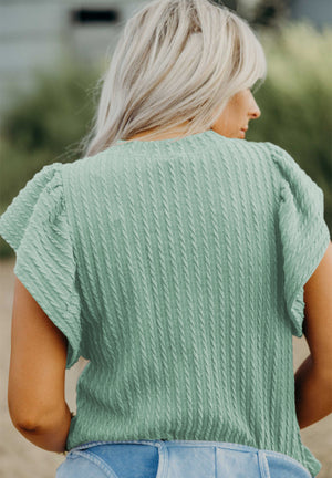 Textured cable knit top in Gum Leaf with flutter sleeves and a casual fit.