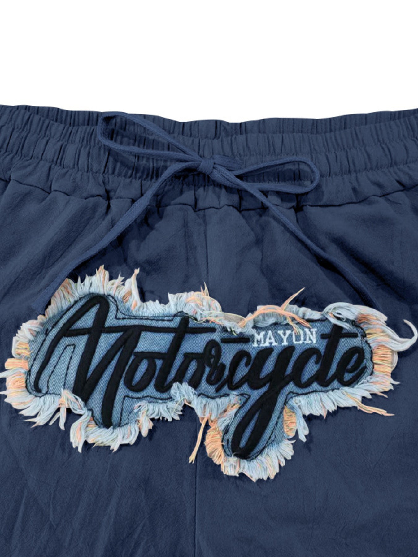 Navy blue drawstring sweatpants with a "Motorcycle" graphic patch and frayed trim.