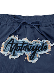 Navy blue drawstring sweatpants with a "Motorcycle" graphic patch and frayed trim.