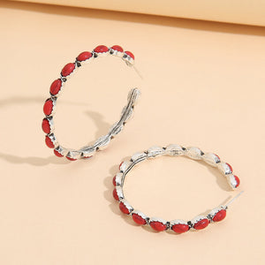Red stone hoop earrings with textured silver alloy setting