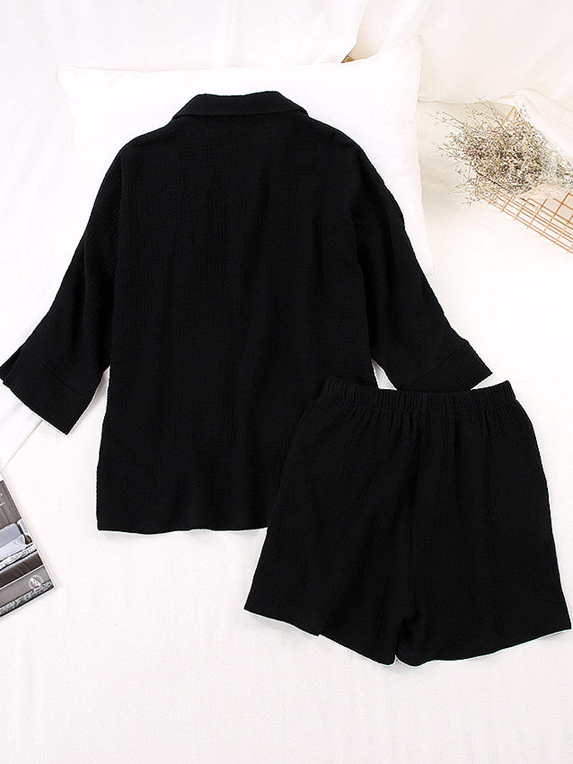 Black gauze cotton resort shirt and shorts set with a collared neckline and buttoned front.