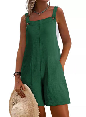 Dark green textured romper with square neckline, button straps, and patch pockets.