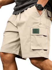 Apricot cargo shorts with drawstring waist and side pocket detail.