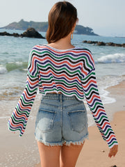 Multicolor wave-stripe crochet cropped sweater with boat neckline and long sleeves.