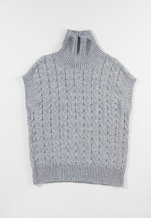 Gray cable knit turtleneck capelet sweater with ribbed trim and sleeveless design.