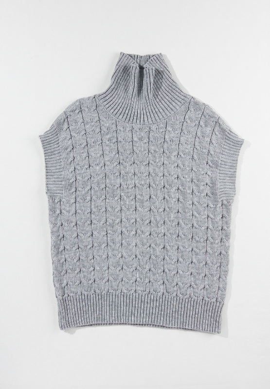 Gray cable knit turtleneck capelet sweater with ribbed trim and sleeveless design.